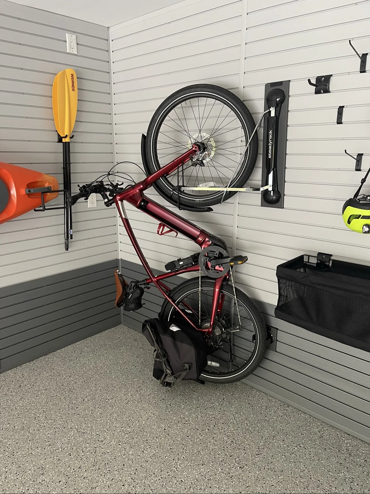 Slatwall with bike, paddle, and tool hooks